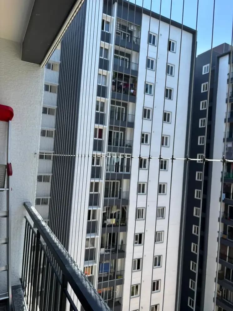 EverSafe Safety Nets team installing balcony safety net and invisible grill