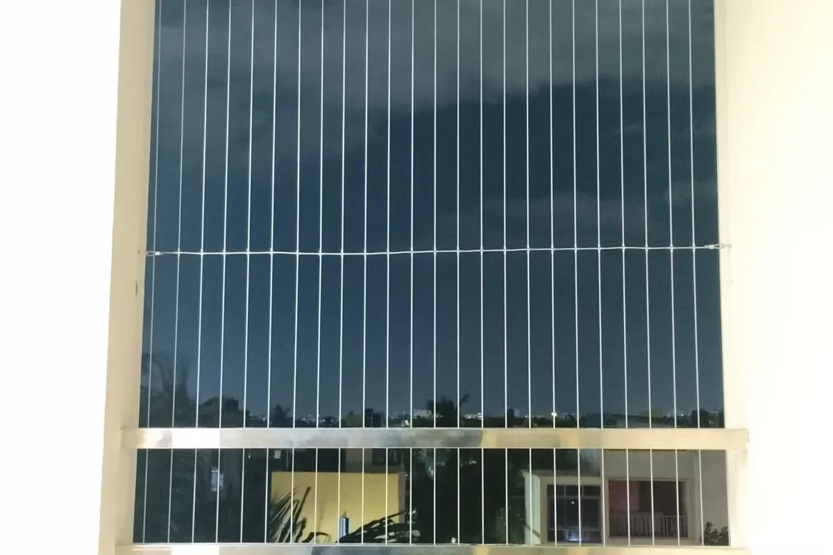 Invisible grill cable layout at an apartment window
