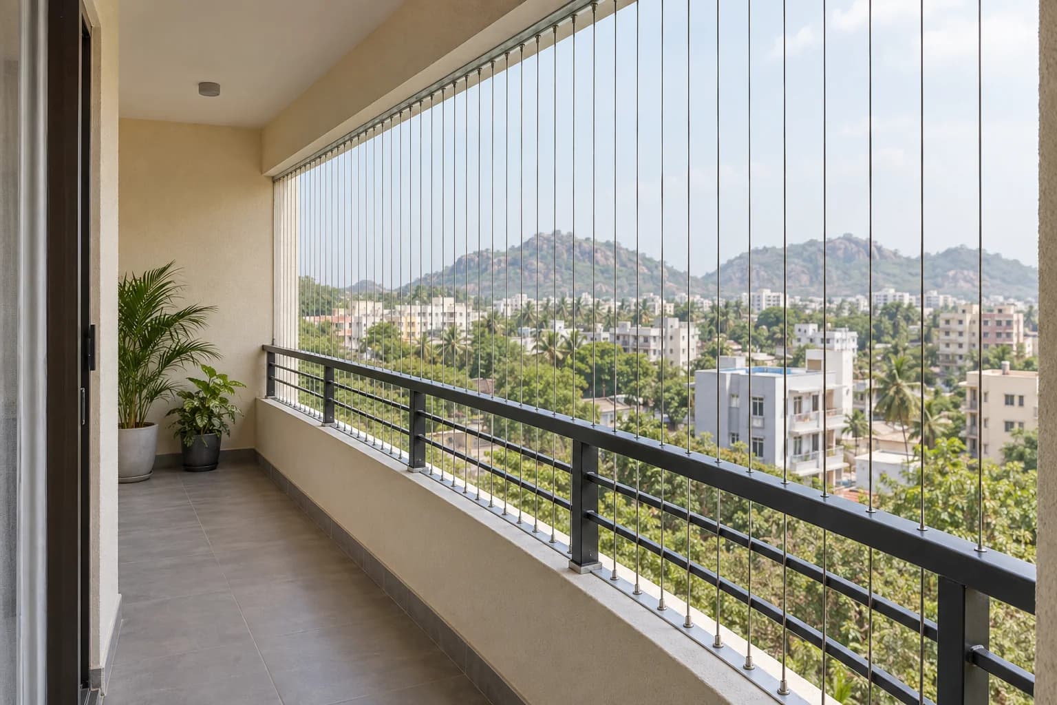 Illustration of slim stainless cables across an inland Andhra apartment balcony with low hills beyond