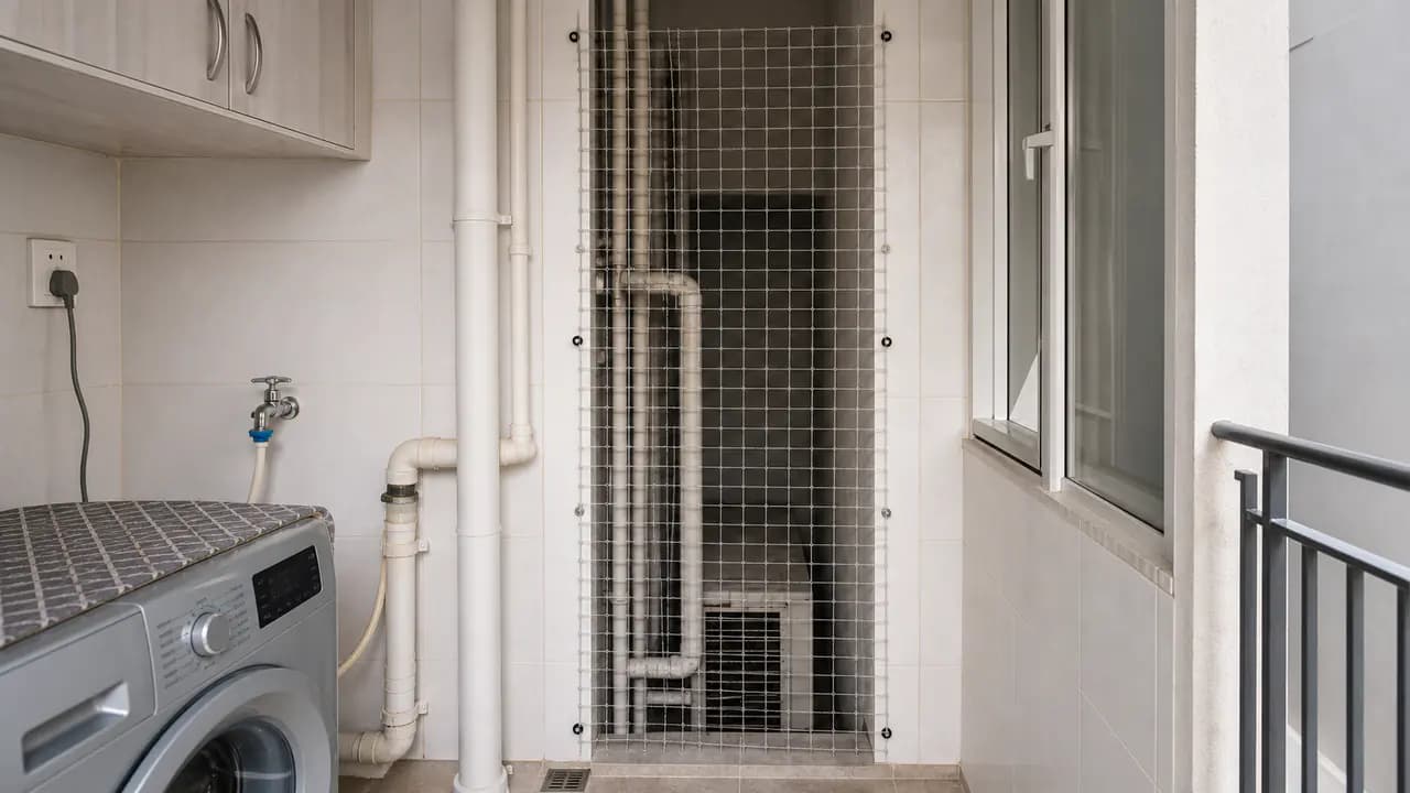 Illustrative utility room beside a netted pipe shaft