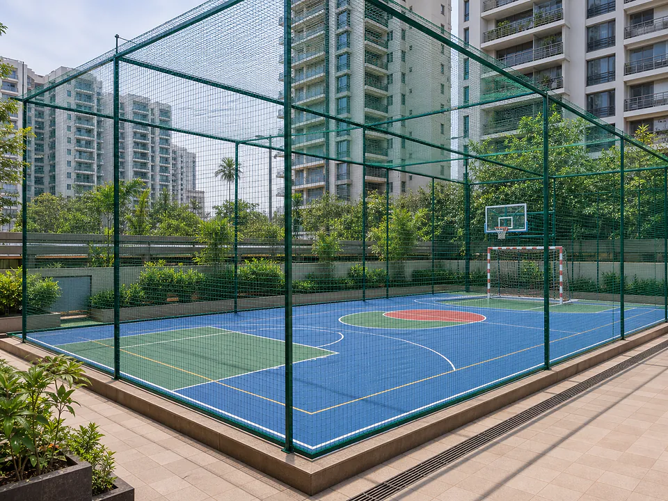 Apartment sports court enclosed with ball-stop netting